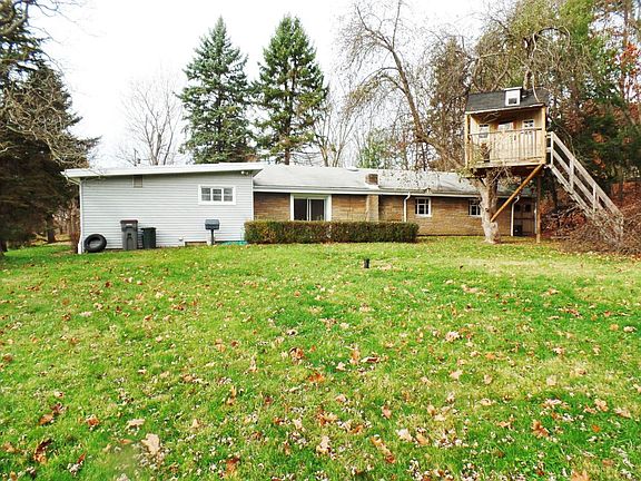 Lavel rear yard w playhouse
