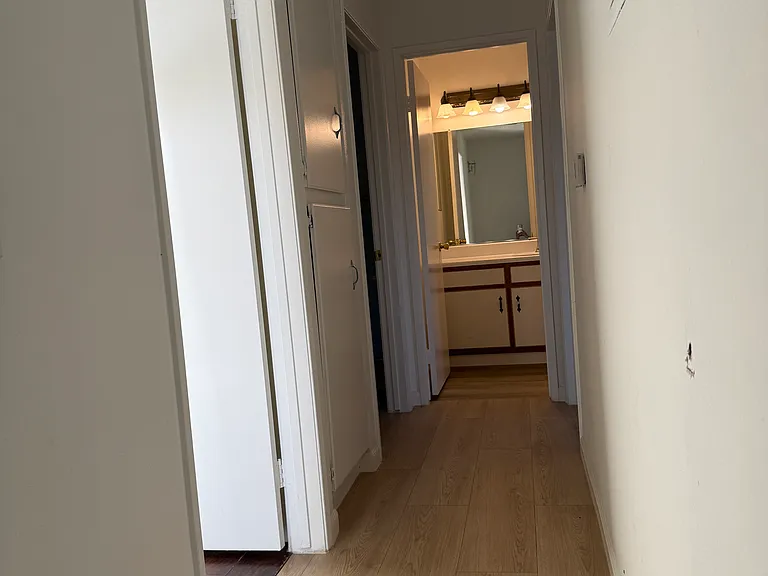 Top of stairs view (two bedrooms on the left and one bedroom on the right)