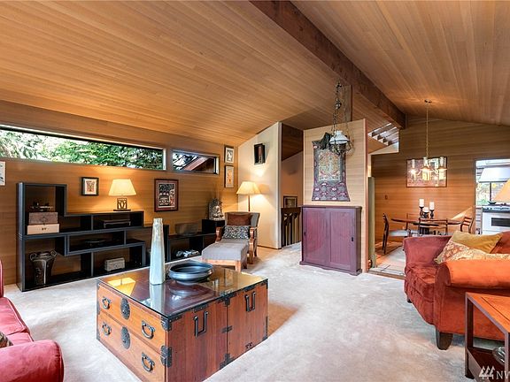 Exposed beams & skylights offering natural light.