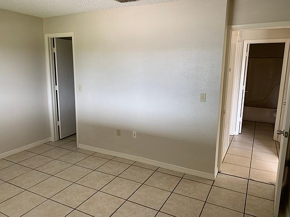 Front bedroom with closet and bath access in hall