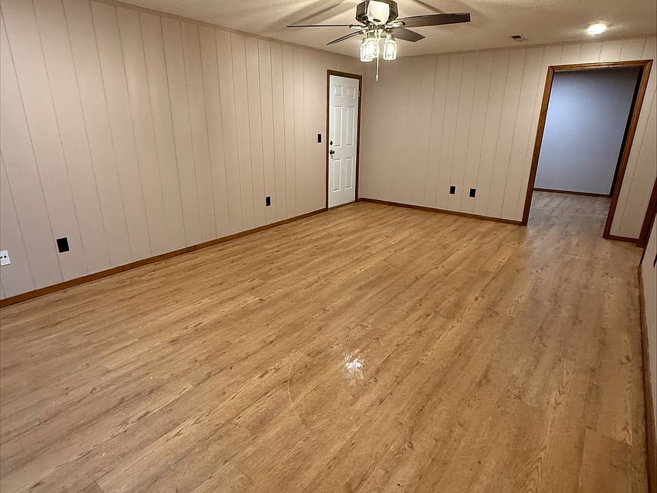 Living room, going into the kitchen and a side door to the backyard