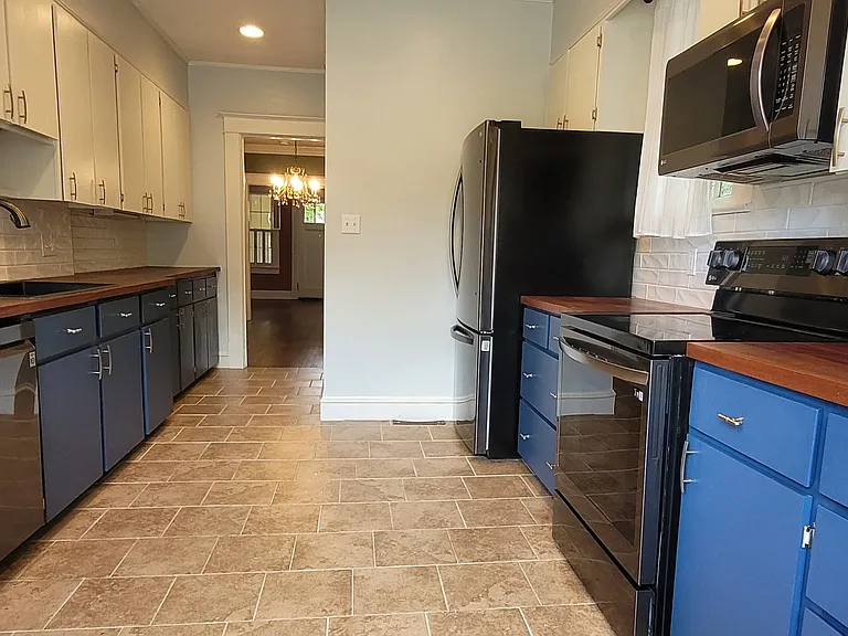 Beautiful wood countertops, modern appliances, and ample cabinet space