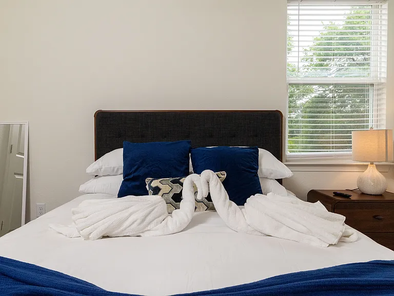 Bedroom 2 offers a cozy queen bed and a flat-screen TV_perfect for unwinding in comfort.