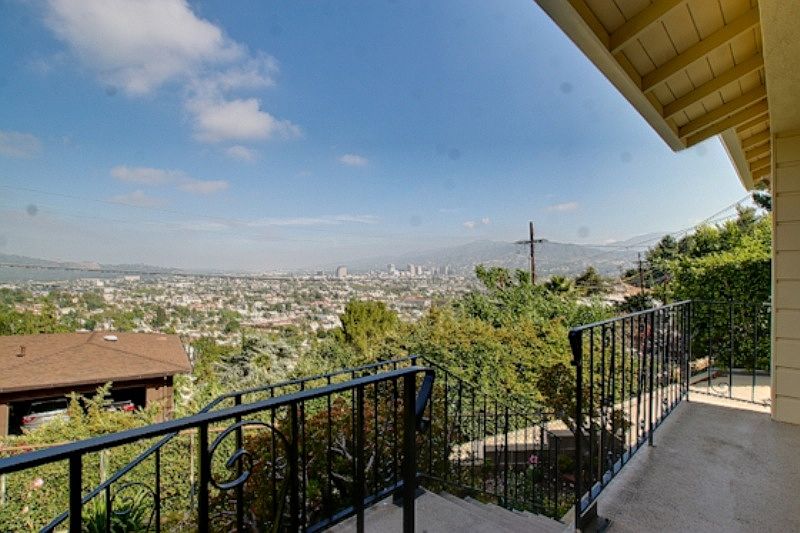 Wide open city view from front yard, porch, living room & be
