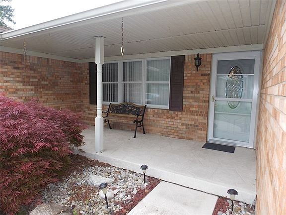 Closer view of home showing stamped concrete sidewalk and 17 X 6 covered front porch.