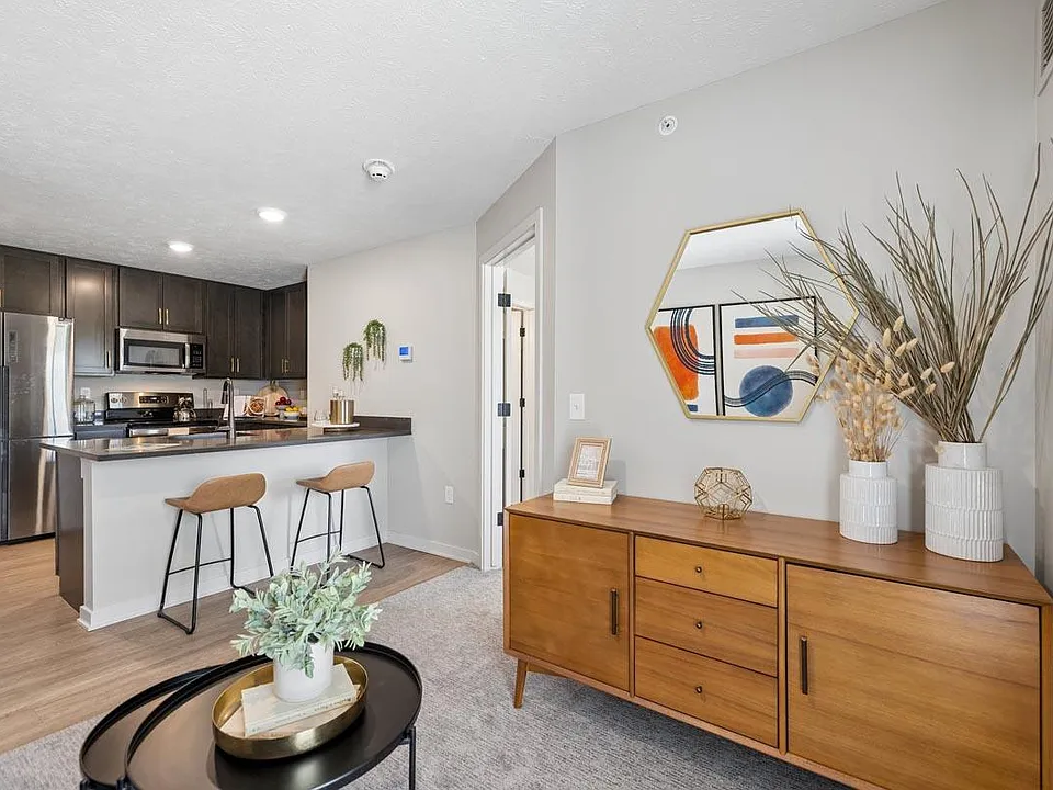 Warm wood accents and an open-concept design create a welcoming space that feels both stylish and effortlessly connected.