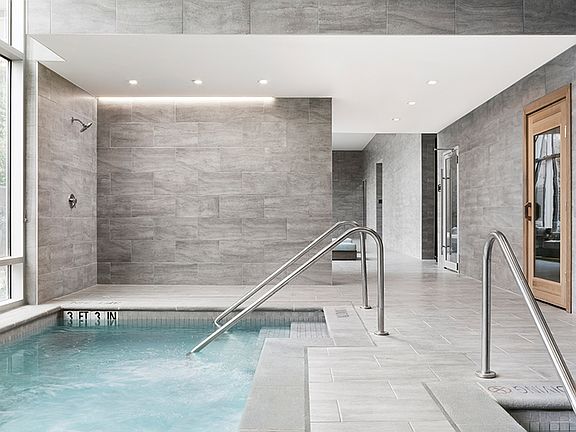Wellness spa with individual massage, steam and sauna rooms, hot tub, and cold plunge