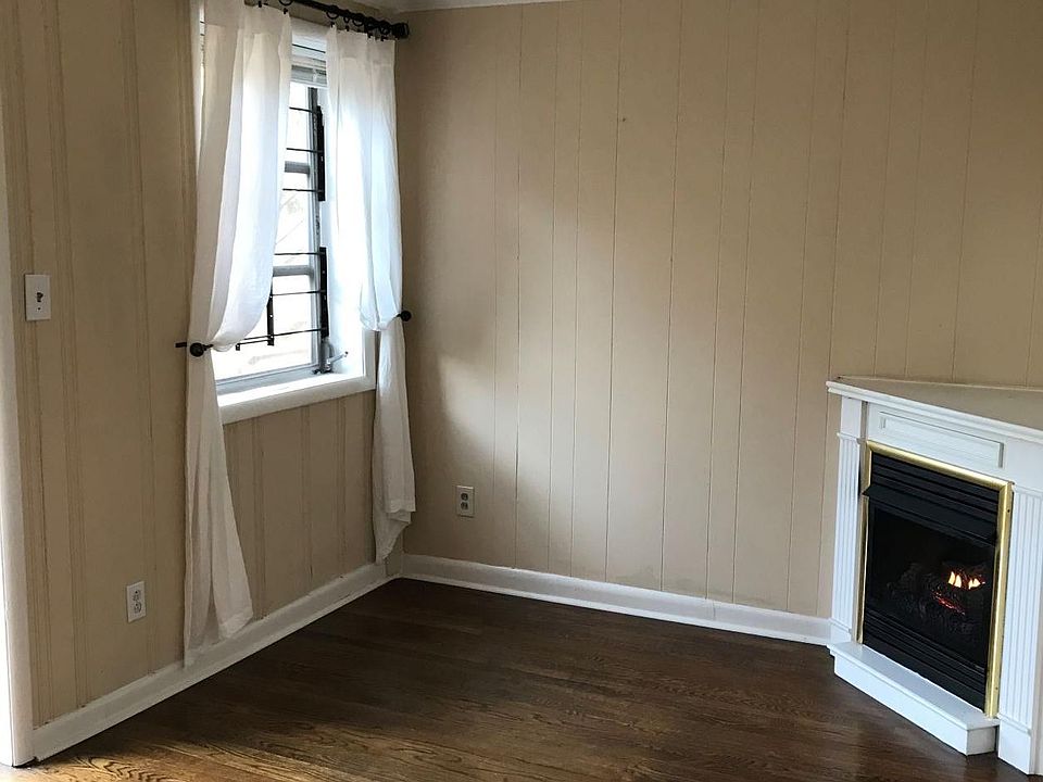 Bonus room at front of unit with fireplace.