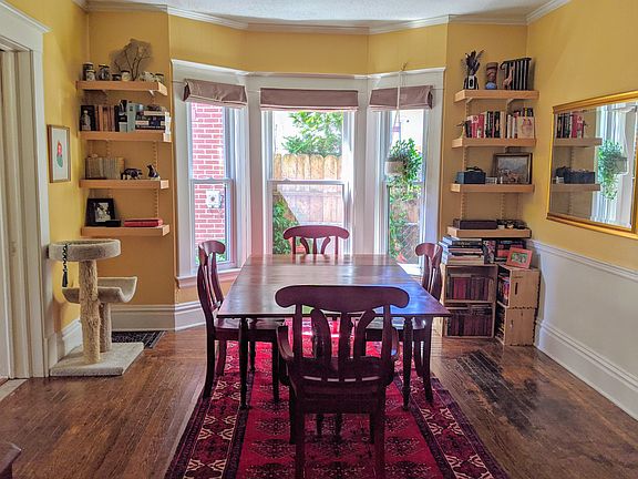 A bay window in the dining room brings in lots of light.