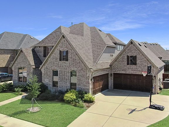 Four car garage plus large driveway!