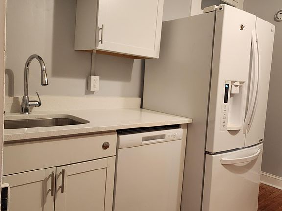 New cabinets and counters, dishwasher, breakfast bar