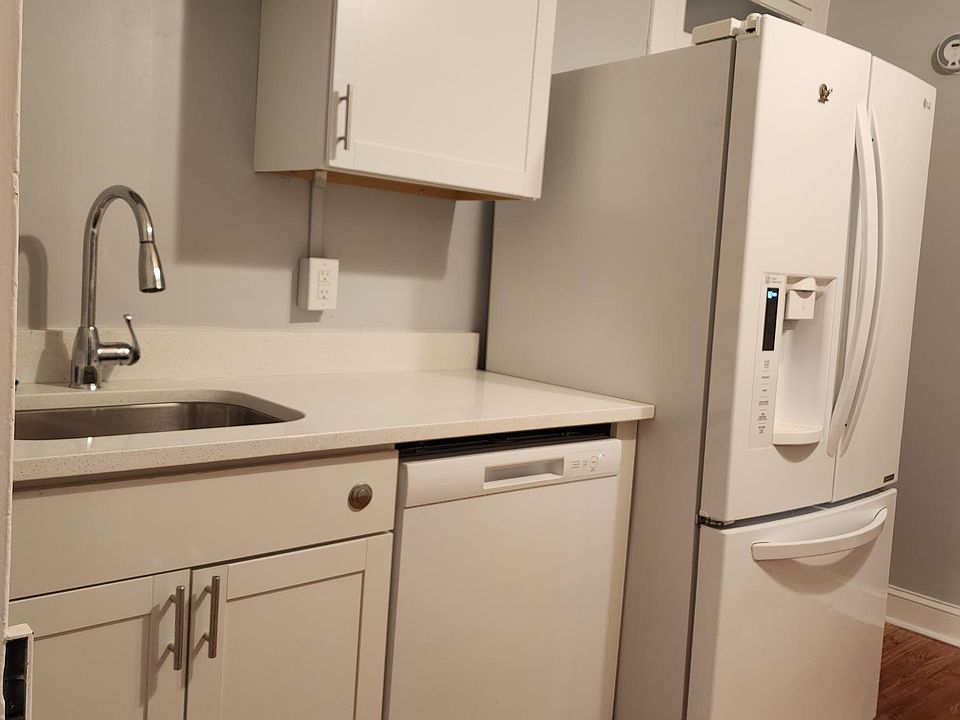New cabinets and counters, dishwasher, breakfast bar