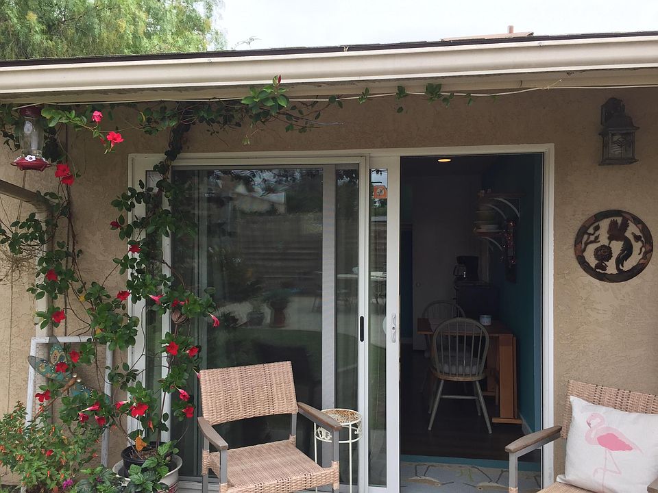 Keyed sliding glass door entry from a beautiful back yard. There's a keyed interior door to the shared laundry area.