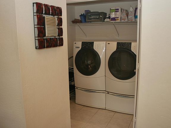 Front load washer/dryer. High efficiency washer. Located next to kitchen and downstairs bathroom.