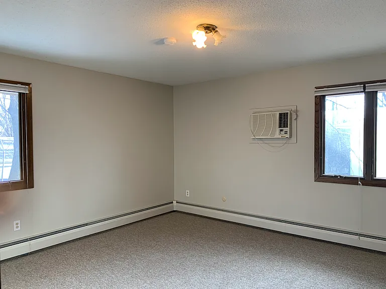 East bedroom has two windows and air conditioning