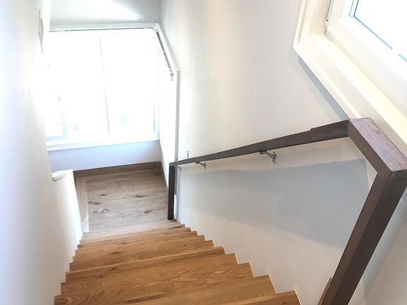 Entry to 2 nd floor bedroom with private bathroom & vet bar