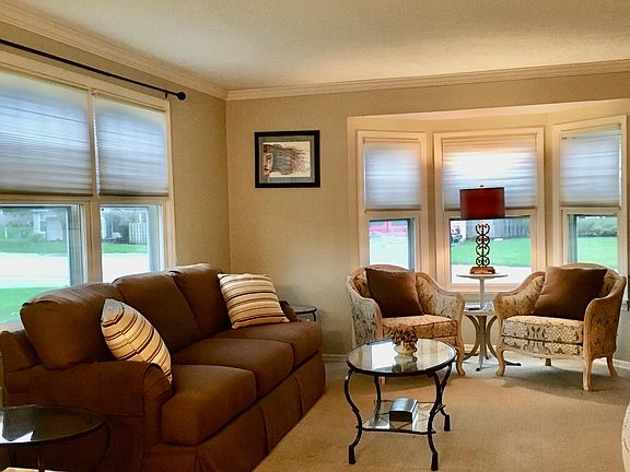 Bright and spacious living room comes furnished.