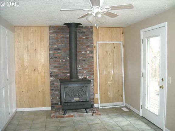 Woodstove in nook with built ins 