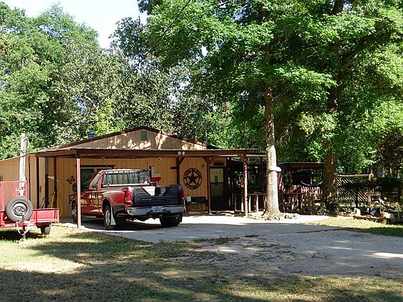 Nice carport at front door.