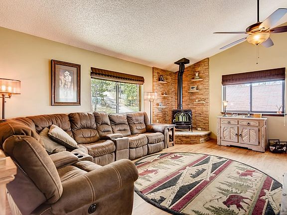The open concept living room is spacious with gleaming hardwood floors.