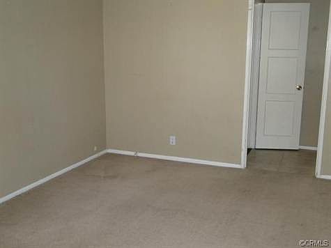 Lower unit Living room with view of hallwaycloset