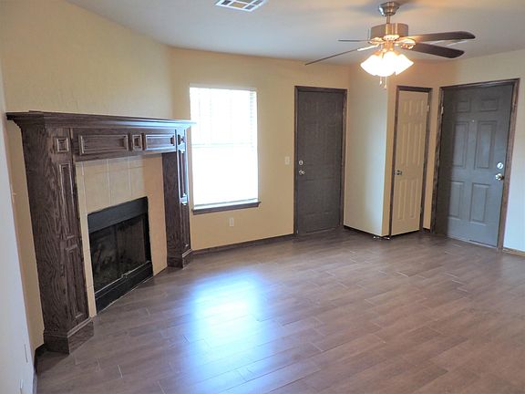 Living room. Door on right is front door. Door on left leads to the back yard.