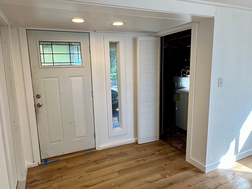 Welcoming entrance with a brand new door, window and flooring