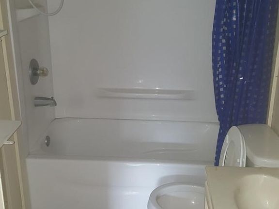 Bathroom, but now has new vinyl plank flooring.