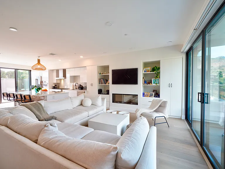 Living room with Samsung Frame TV and electric fireplace