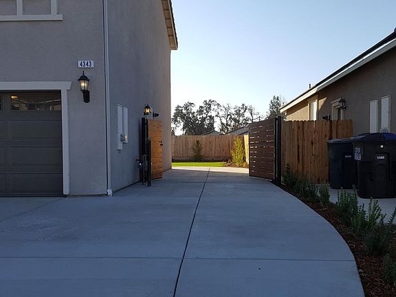 RV parking with gate on side of home