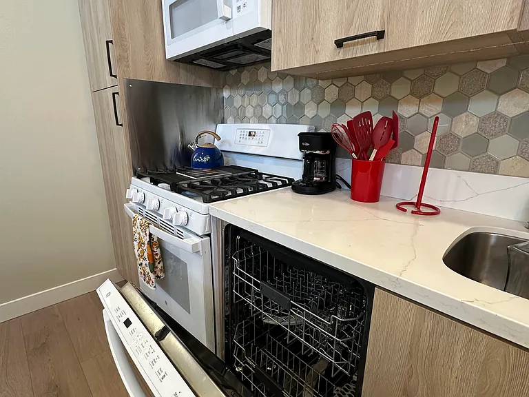 Kitchen with full-sized appliances, including dishwasher
