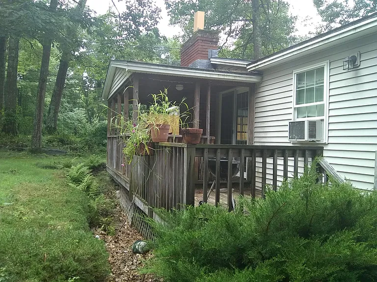 Covered porch and open deck overlooking private yard