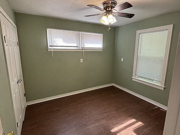 two walls of windows in bedroom