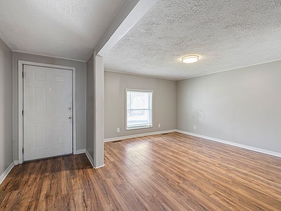 Living room with front door on left
