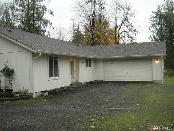 Front side of home with two car attached garage.