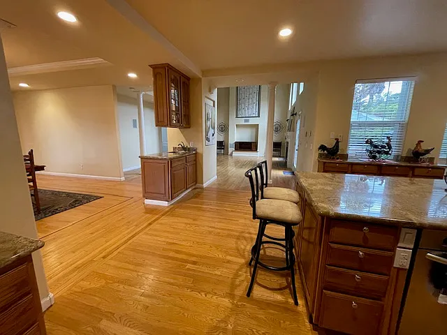 Kitchen flows through to Great Room, Wet Bar, and Dining Room