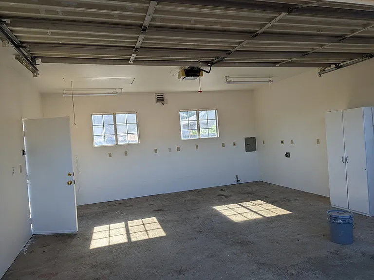 9 ft ceiling shop with 110v and 220v outlets all the way around