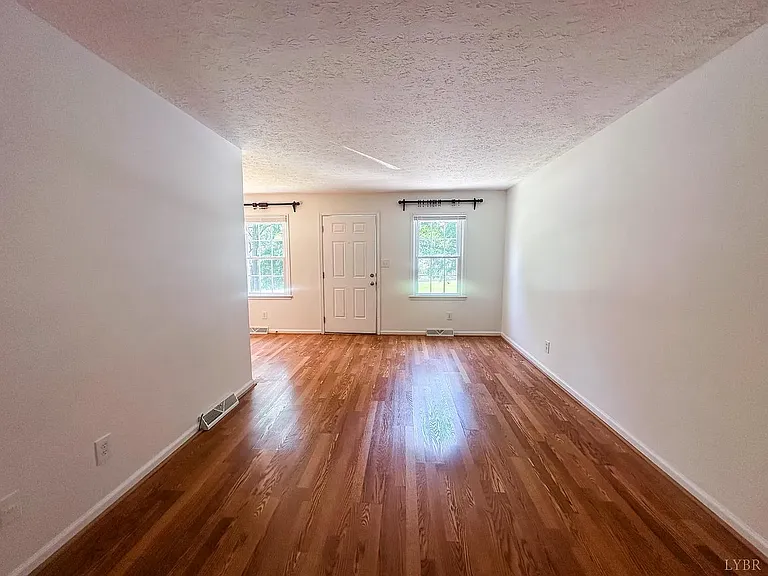 comfortable living area offering a warm, inviting atmosphere and plenty of room for your favorite furniture