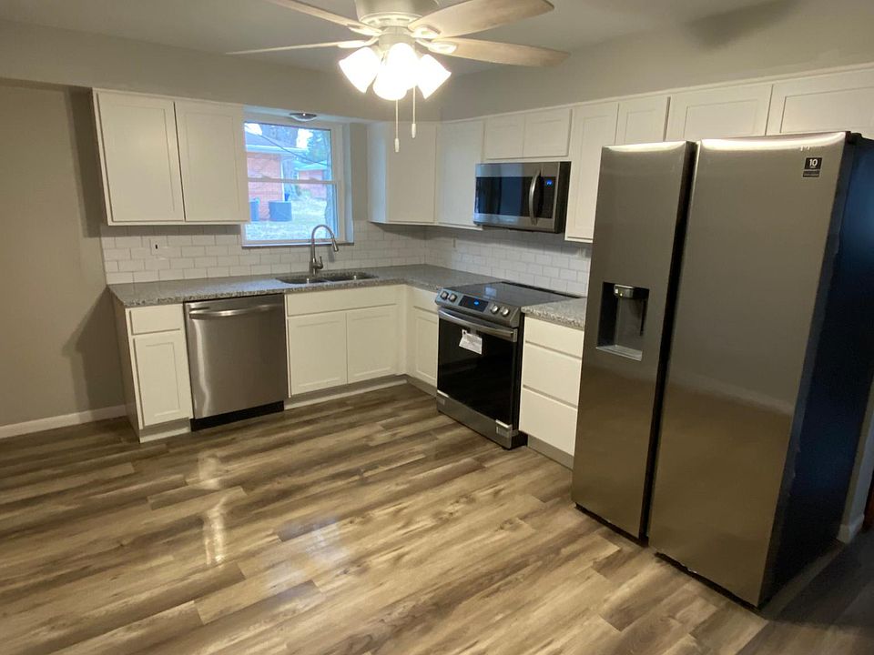 Newly remodeled kitchen contains new cabinets with lots of storage space