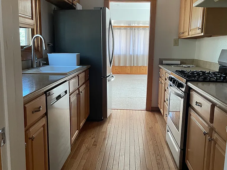 Kitchen: gas stove, dishwasher, ice maker. All recently updated appliances. Clean, drinkable well water.