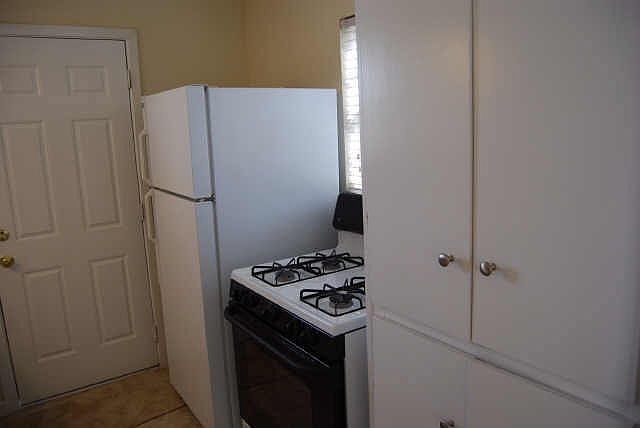 Updated kitchen with stove and fridge