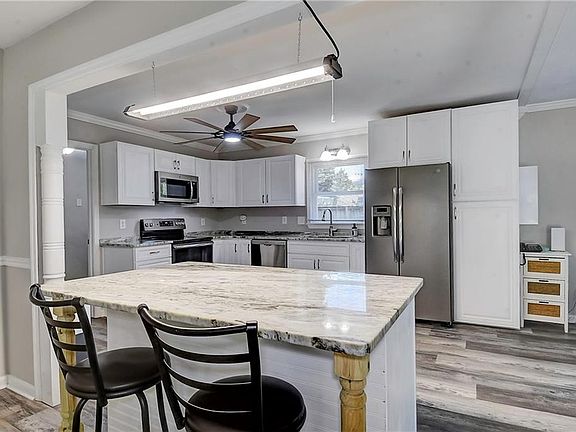 Beautiful granite countertops and stainless steel appliances.
