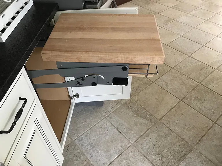 Kitchenaide or other blender pullout. Very easy to use. Pull out of cabinet, use, then easily pull up on black piece and it goes back into the cabinet