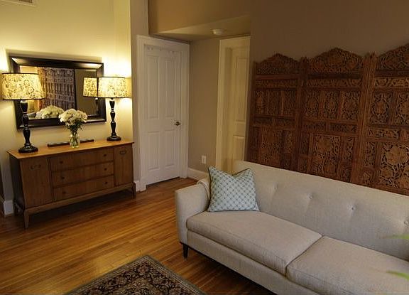 Living room facing bedroom doors