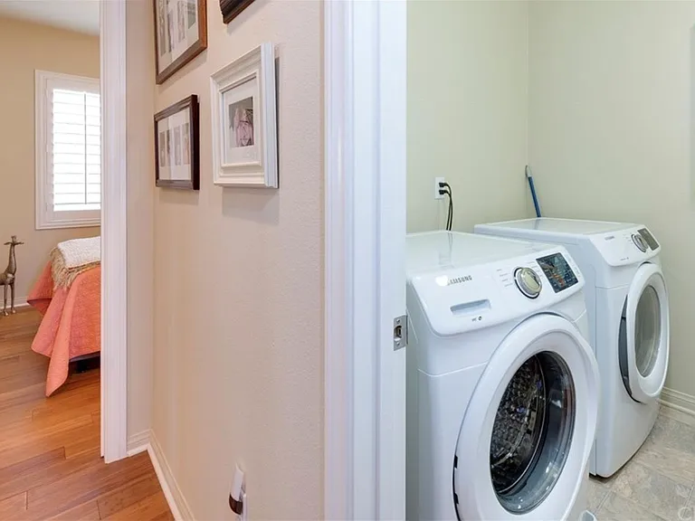 Laundry Room with lower cabinet across