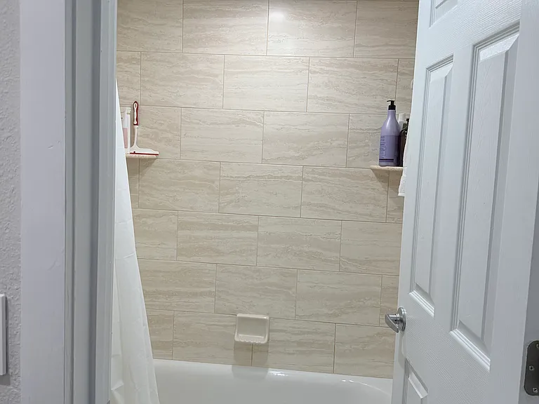 Main bedroom bathroom with tub.