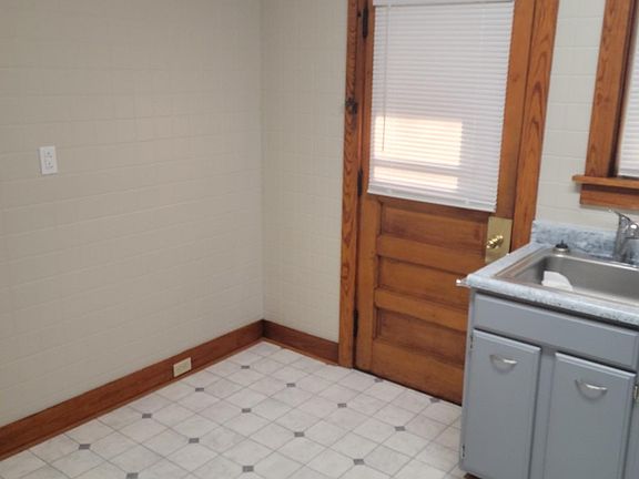 Kitchen back door. New refrigerator and stove being on order.