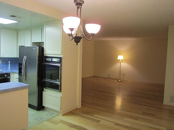 Kitchen / open to dining and into living room  ( view from d