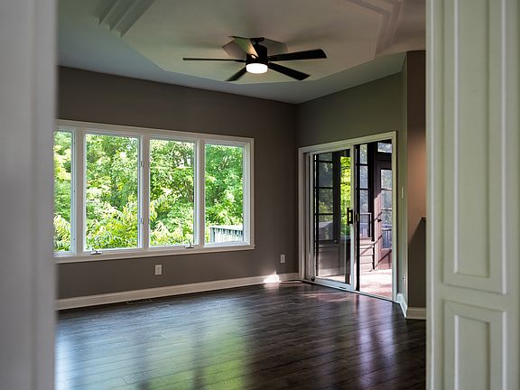 Spacious breakfast nook with easy access to the screened-in porch and deck space.