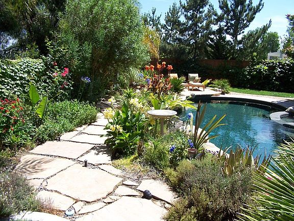 PATH BEHIND PEBBLE TECH POOL AND SPA